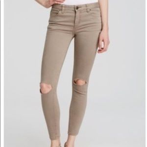 Tan distressed skinny jeans